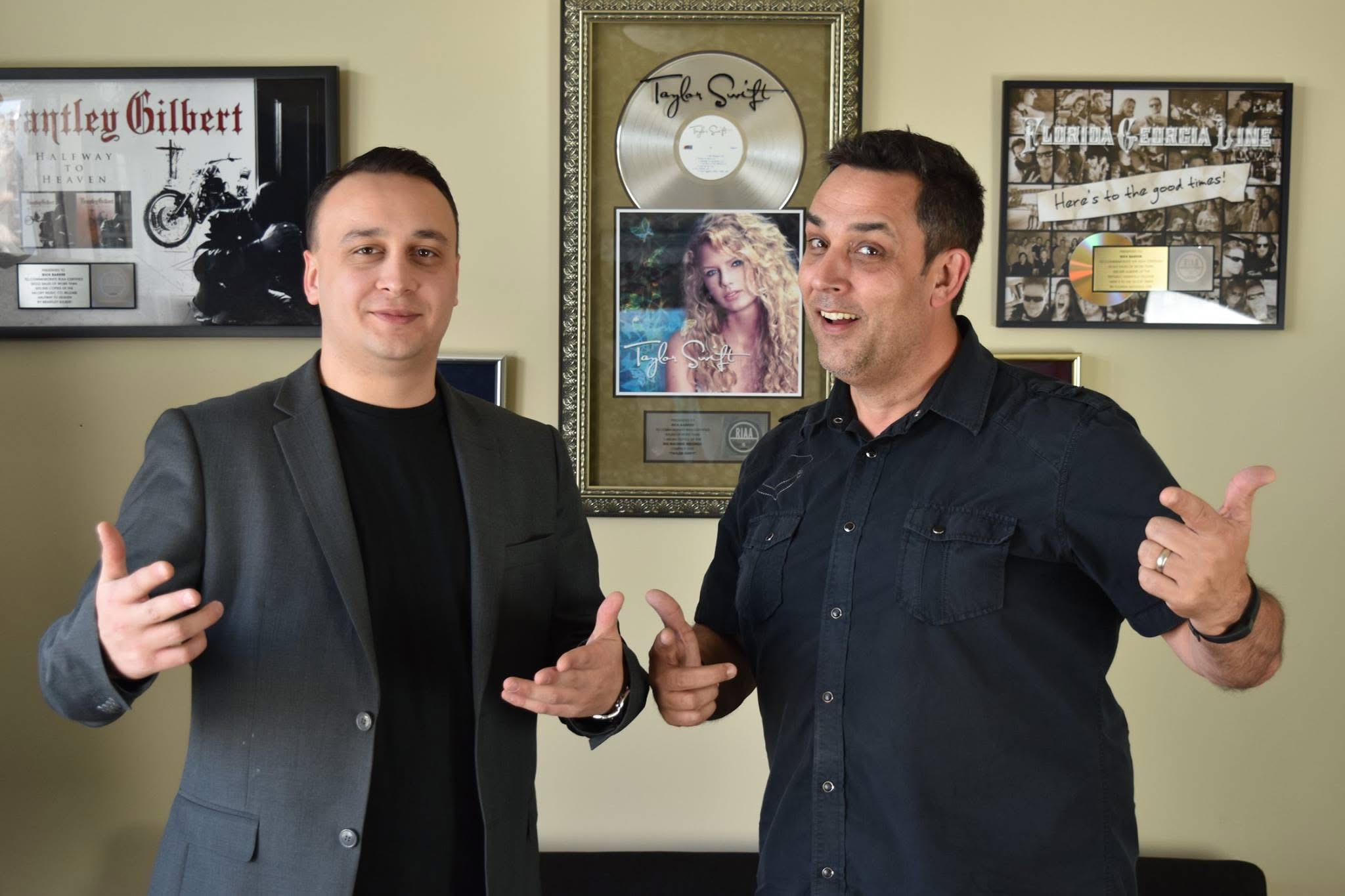 Michael Eastwood with Rick Barker in front of Taylor Swift platinum disc